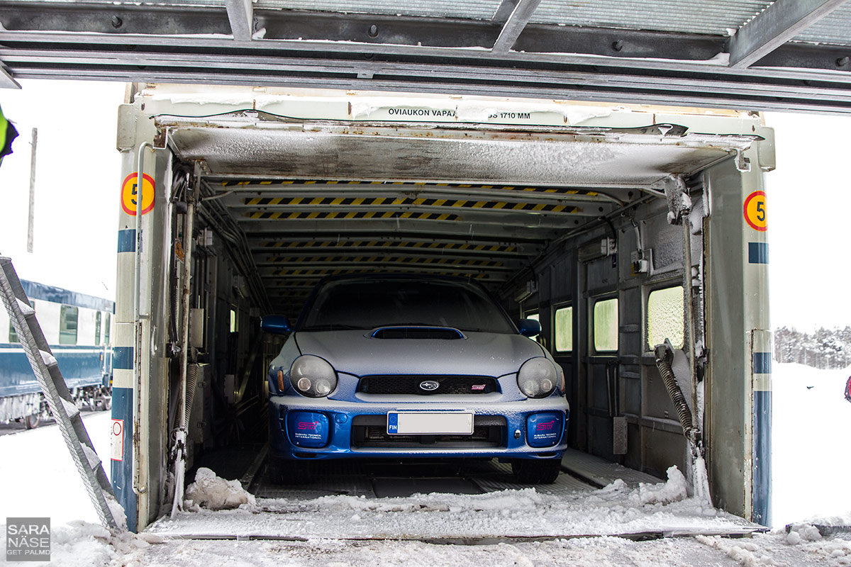 Snowy Subaru on car train