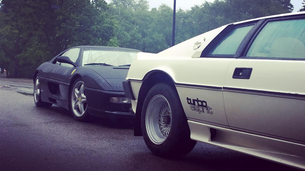 Ferrari F355 berlinetta and Lotus Turbo Esprit in rain