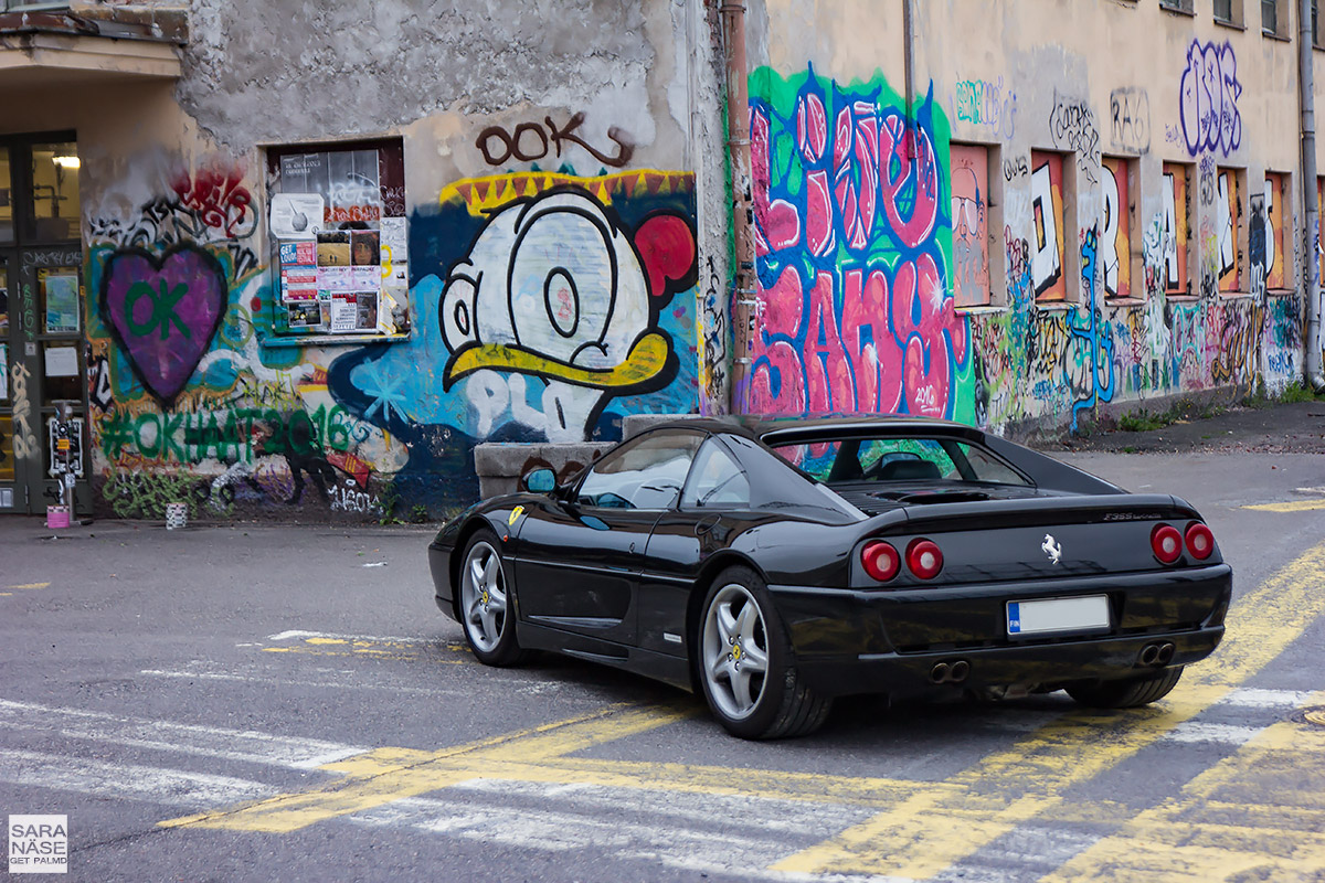 Ferrari F35 berlinetta rear view in front of graffiti wall