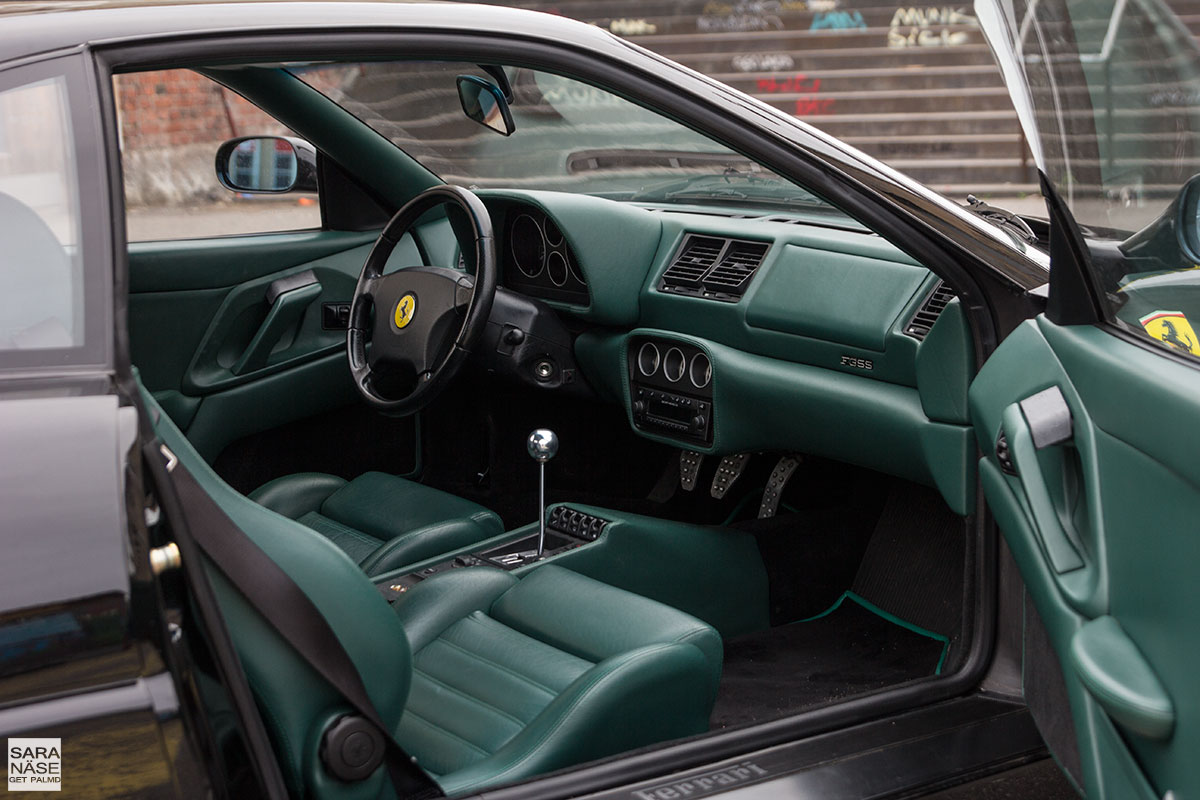 Black Ferrari F355 berlinetta with green leather interior